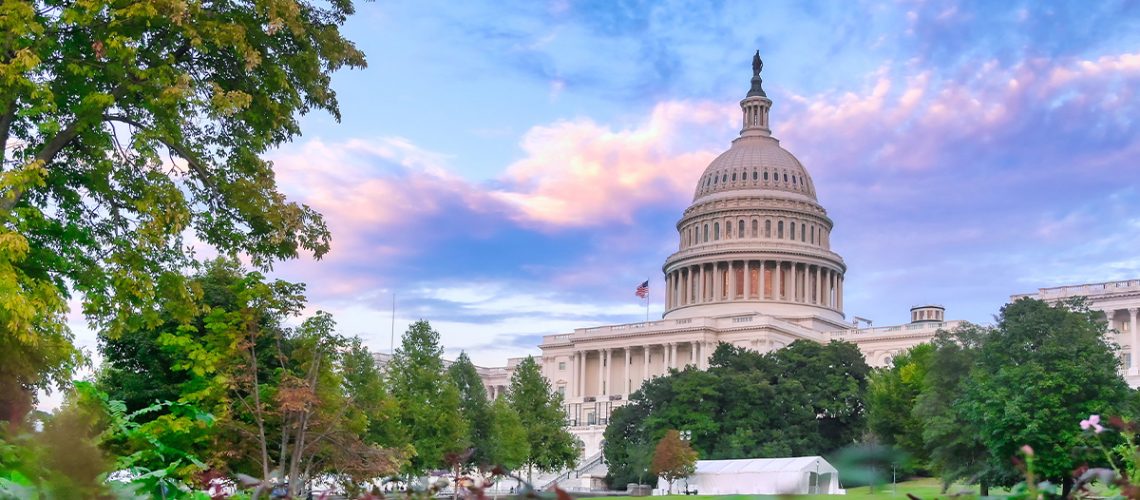 The US capital building with a partly cloudy sky