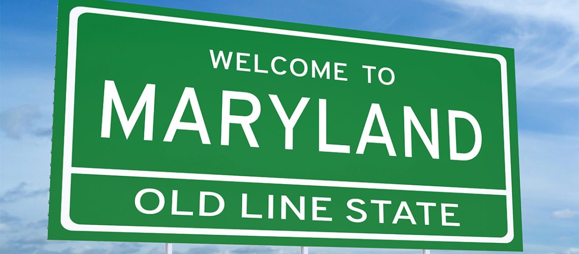 A Maryland road sign with a blue sky background